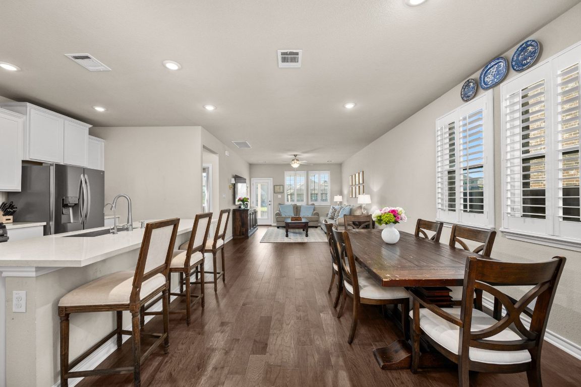 280 Pepperbark Loop Buda, TX 78610 - Photo 6 of 38 Dining area featuring dark wood finished floors, ceiling fan, and recessed lighting