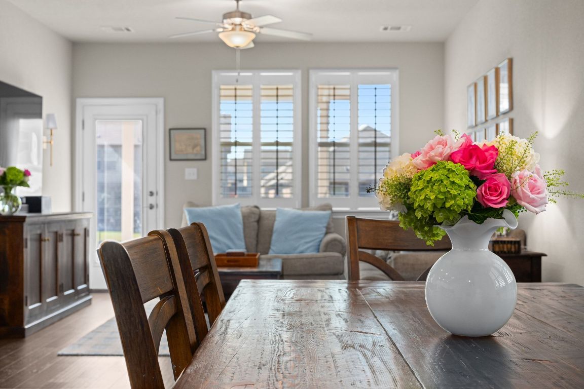 280 Pepperbark Loop Buda, TX 78610 - Photo 8 of 38 Dining area with plenty of natural light, a ceiling fan, and wood finished floors