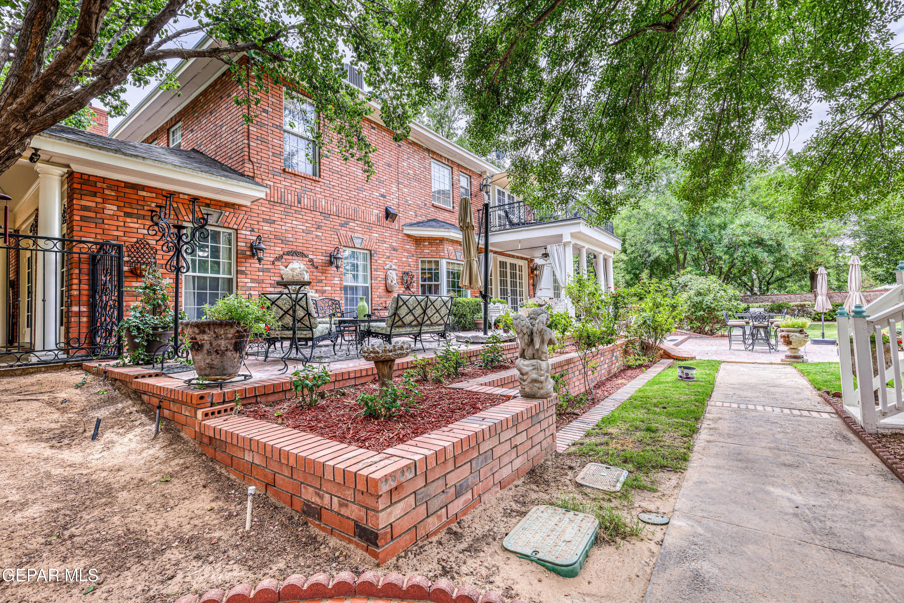501 Country Club Road El Paso, TX 79932 - Photo 80 of 88 a view of a patio with couches table and chairs and potted plants