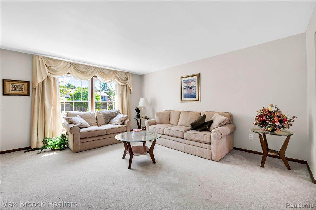 217 Stonetree Circle Rochester, MI 48309 - Photo 6 of 44 Spacious room featuring light-colored carpeting and neutral wall tones