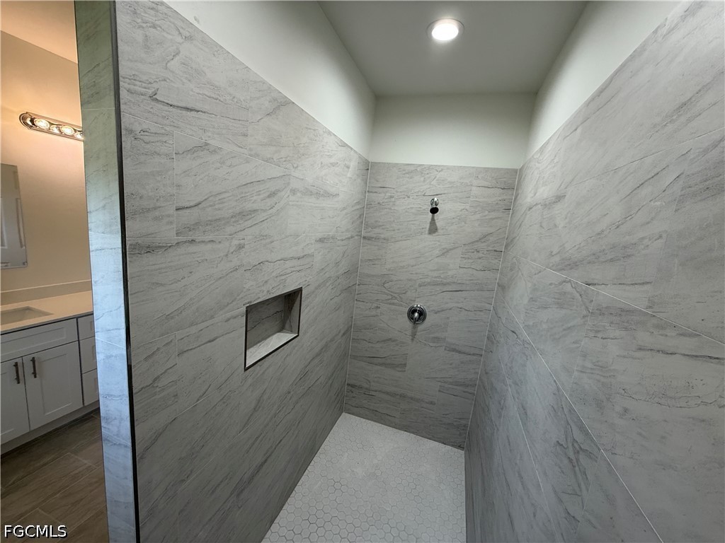2809 Darlene Place Lehigh Acres, FL 33971 - Photo 14 of 26 a bathroom with a shower