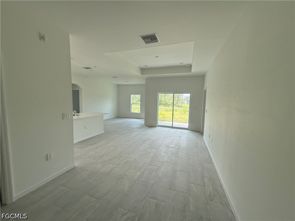 2809 Darlene Place Lehigh Acres, FL 33971 - Photo 2 of 26 a view of an empty room with a window