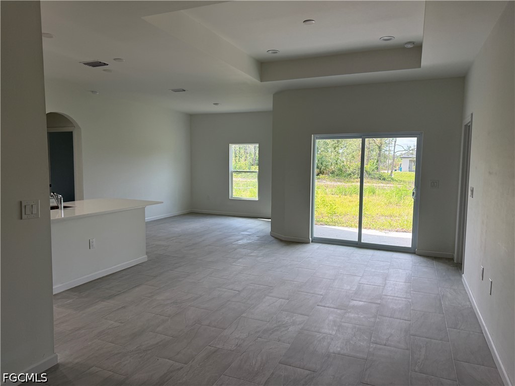 2809 Darlene Place Lehigh Acres, FL 33971 - Photo 3 of 26 a view of an empty room with a window