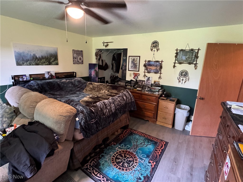 71322 Sharon Road Bridgeport, OH 43912 - Photo 15 of 39 Bedroom featuring wood finished floors and a ceiling fan