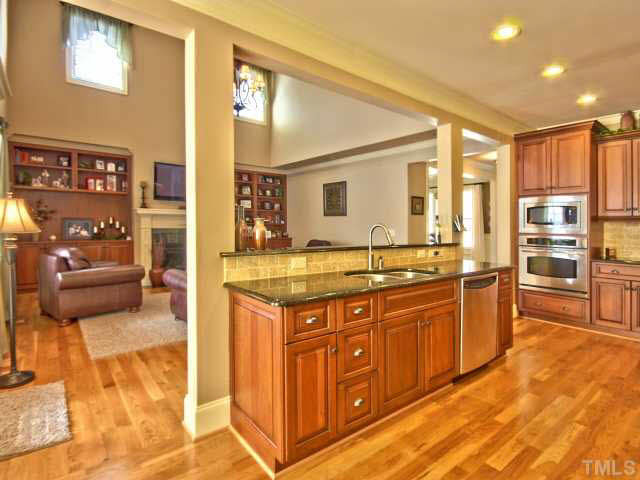 9705 Bailey Grove Court Raleigh, NC 27613 - Photo 8 of 25 Kitchen is completely open to the family room with great flow for entertaining family and friends.