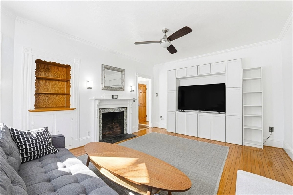 73 Hudson Street Milton, MA 02186 - Photo 11 of 42 a living room with furniture and a flat screen tv