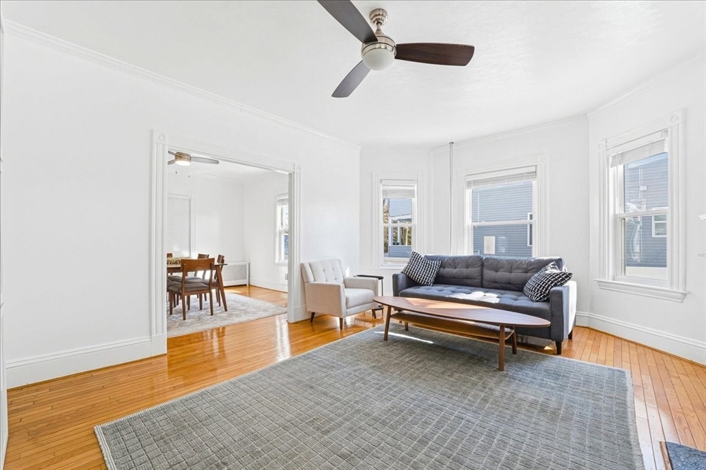 73 Hudson Street Milton, MA 02186 - Photo 13 of 42 a living room with furniture and a window