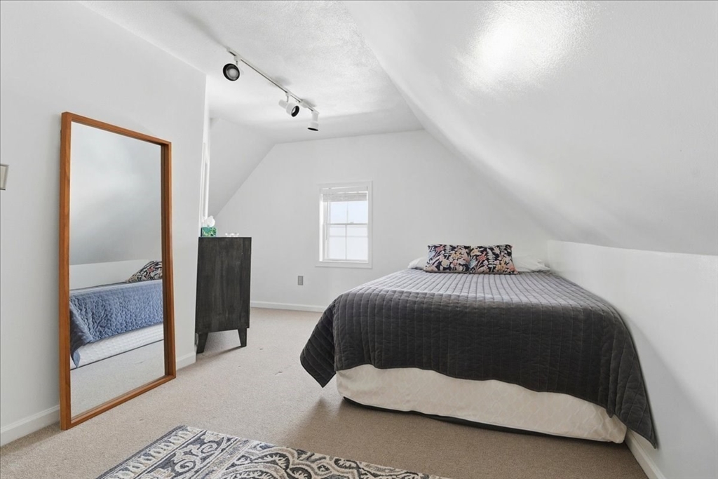 73 Hudson Street Milton, MA 02186 - Photo 20 of 42 a bedroom with a bed and a mirror