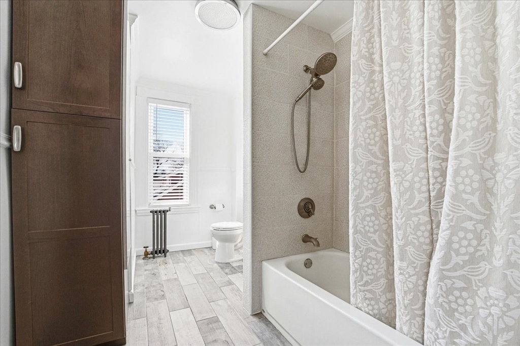 73 Hudson Street Milton, MA 02186 - Photo 26 of 42 a bathroom with a bathtub a toilet and a shower