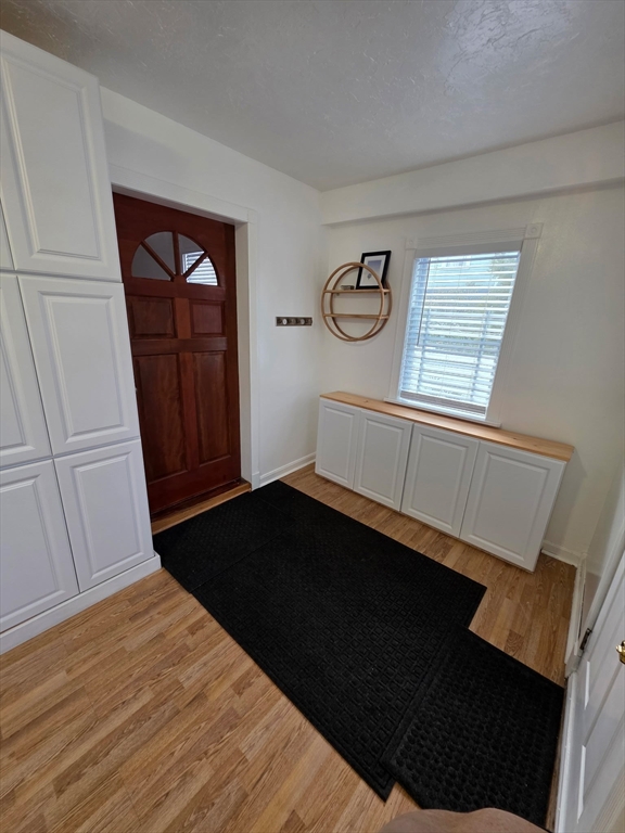 73 Hudson Street Milton, MA 02186 - Photo 28 of 42 a view of empty room with window and fan