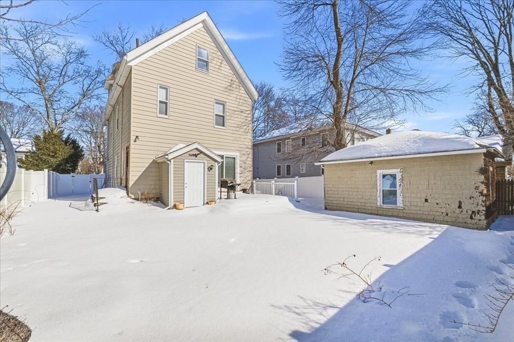 73 Hudson Street Milton, MA 02186 - Photo 29 of 42 a view of a house with a yard and garage