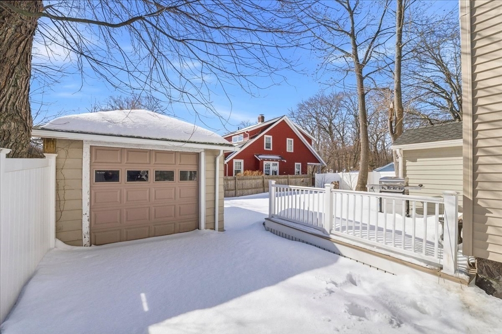 73 Hudson Street Milton, MA 02186 - Photo 30 of 42 a front view of a house with wooden fence