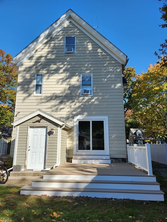 73 Hudson Street Milton, MA 02186 - Photo 33 of 42 a front view of a house with a yard