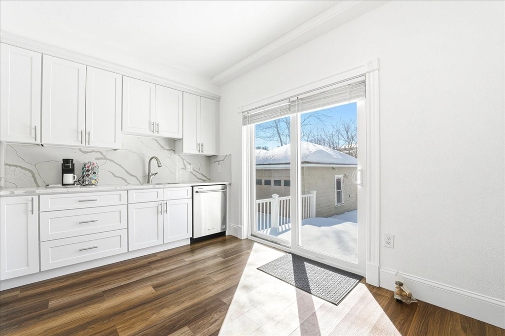 73 Hudson Street Milton, MA 02186 - Photo 10 of 42 a kitchen with white cabinets and sink