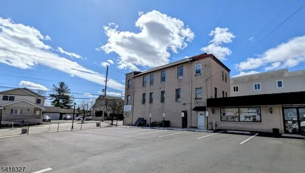 a view of a building with a street
