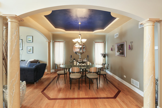 248 Highland Road Willowbrook, IL 60527 - Photo 11 of 25 a dining room with chandelier and wooden floor
