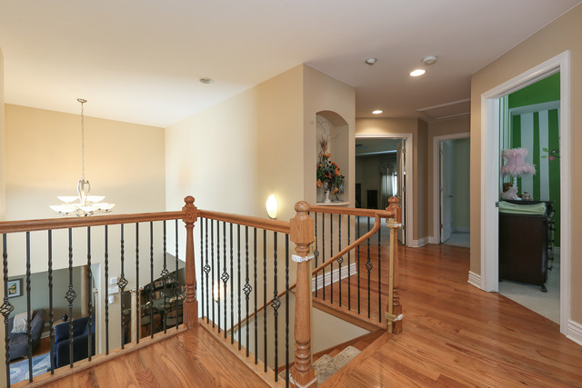 248 Highland Road Willowbrook, IL 60527 - Photo 13 of 25 a view of a hallway with wooden floor and windows