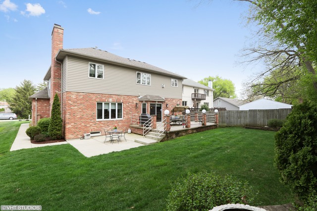 248 Highland Road Willowbrook, IL 60527 - Photo 25 of 25 a view of a house with backyard sitting area and garden