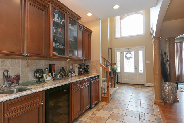248 Highland Road Willowbrook, IL 60527 - Photo 3 of 25 a kitchen with a sink and cabinets