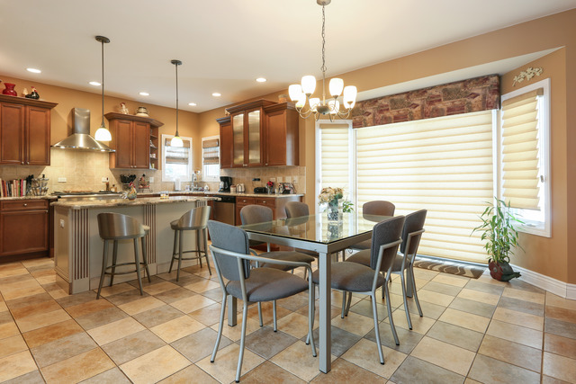 248 Highland Road Willowbrook, IL 60527 - Photo 4 of 25 a large kitchen with a table and chairs