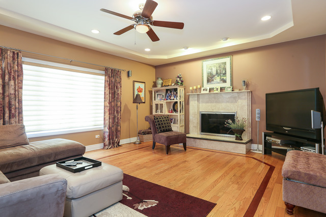 248 Highland Road Willowbrook, IL 60527 - Photo 6 of 25 a living room with furniture and a flat screen tv