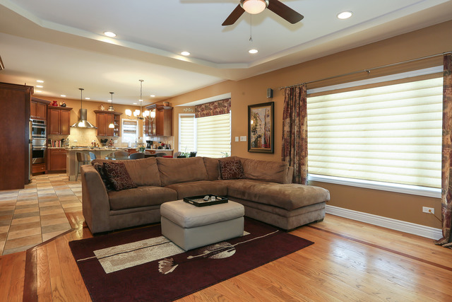 248 Highland Road Willowbrook, IL 60527 - Photo 7 of 25 a living room with furniture and a large window