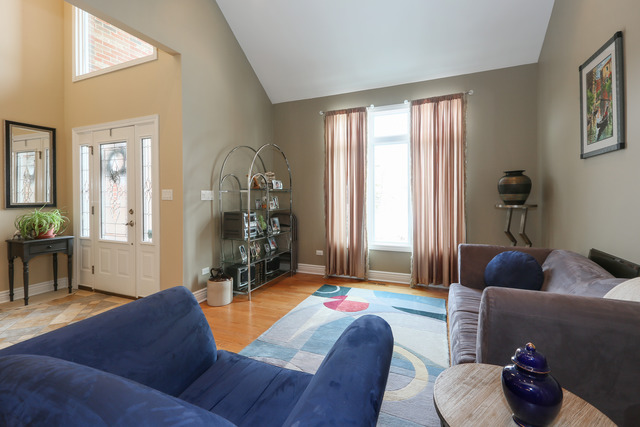 248 Highland Road Willowbrook, IL 60527 - Photo 9 of 25 a living room with furniture and a large window