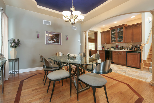248 Highland Road Willowbrook, IL 60527 - Photo 10 of 25 a view of a dining room with furniture and wooden floor