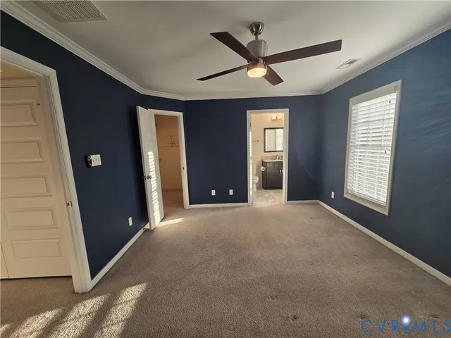 a view of a livingroom with a ceiling fan and window