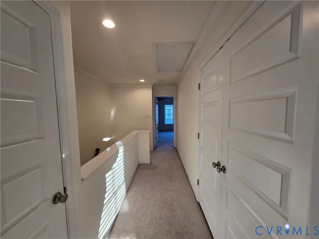 a view of a hallway with white walls