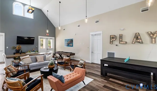 a living room with furniture and a flat screen tv