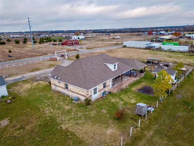 an aerial view of a house with a outdoor space