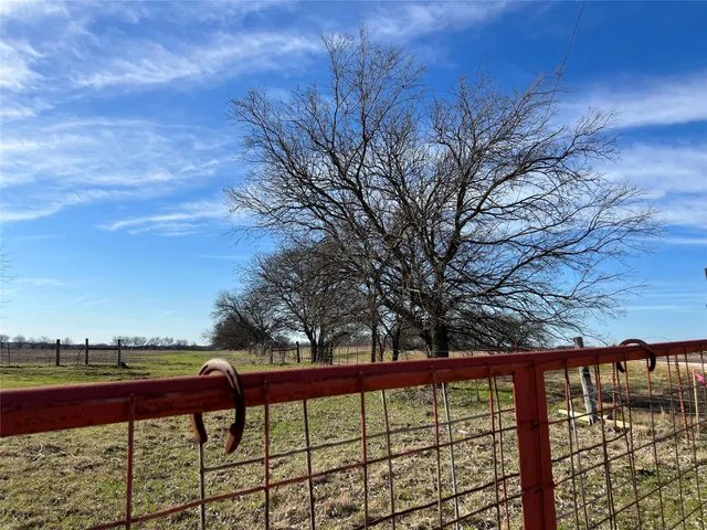 a view of a swimming pool with a yard