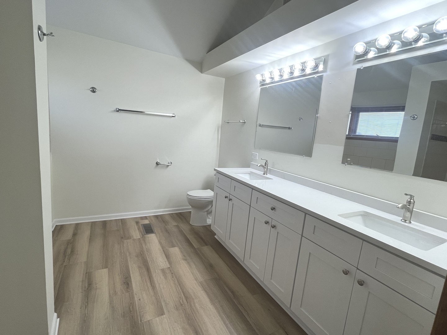 22073 Spring Lane Richton Park, IL 60471 - Photo 14 of 30 a spacious bathroom with a double vanity sink a toilet and a mirror