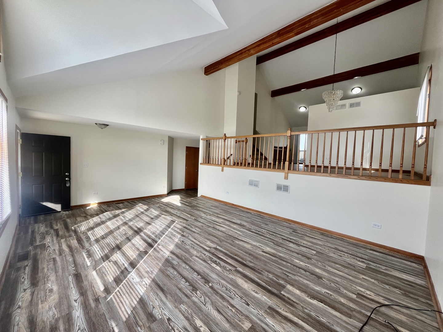 22073 Spring Lane Richton Park, IL 60471 - Photo 3 of 30 a view of a hallway with wooden floor and fireplace