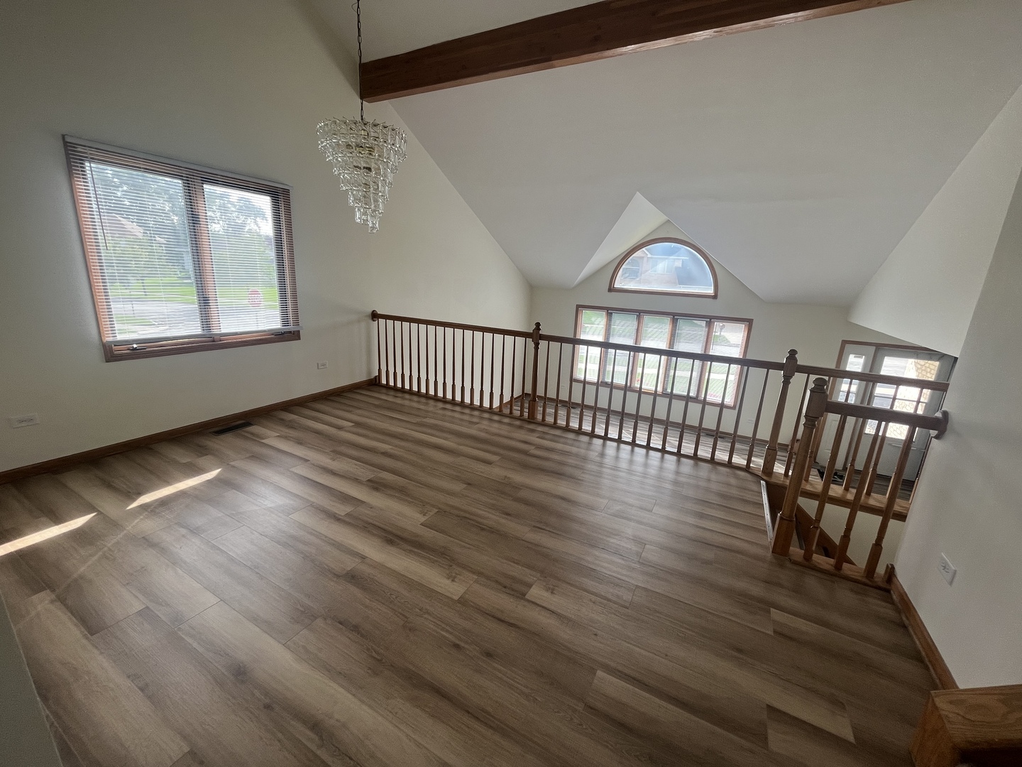 22073 Spring Lane Richton Park, IL 60471 - Photo 4 of 30 a view of empty room with wooden floor fan and windows