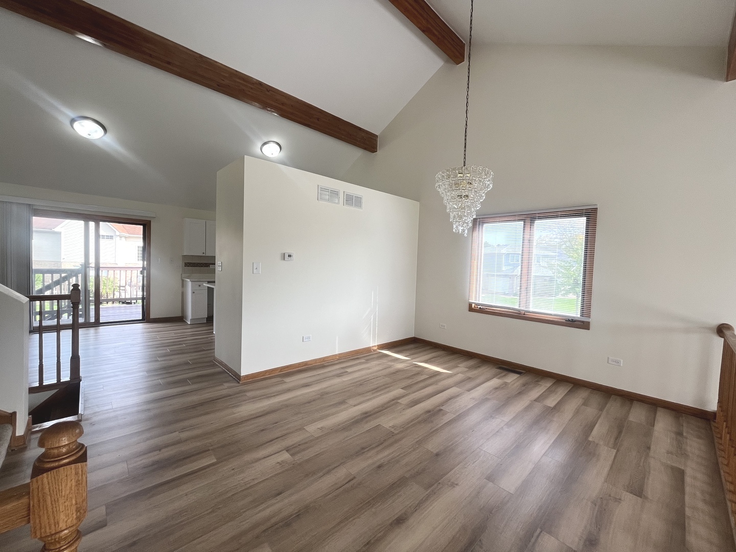 22073 Spring Lane Richton Park, IL 60471 - Photo 5 of 30 a view of an empty room with wooden floor and a window