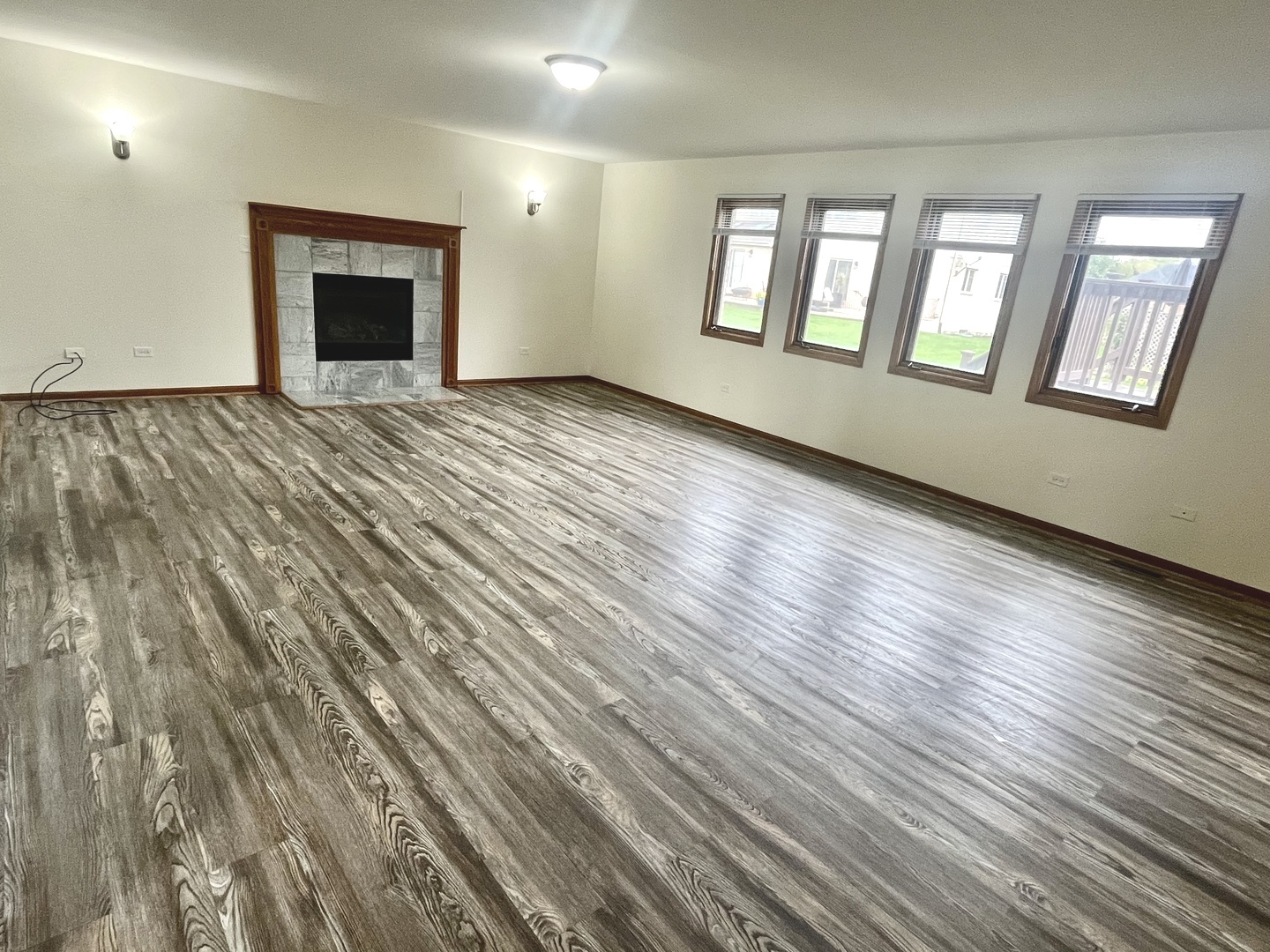 22073 Spring Lane Richton Park, IL 60471 - Photo 9 of 30 a view of an empty room with wooden floor and a window