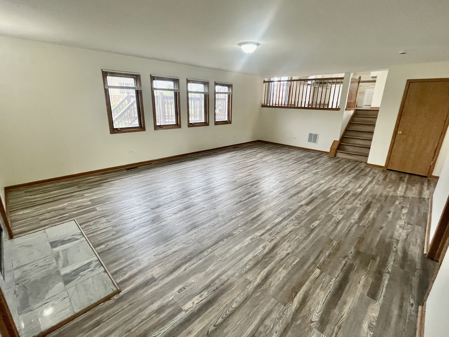 22073 Spring Lane Richton Park, IL 60471 - Photo 10 of 30 an empty room with wooden floor and windows