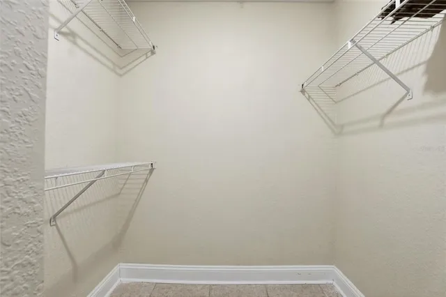 a view of small space with empty racks on the wall