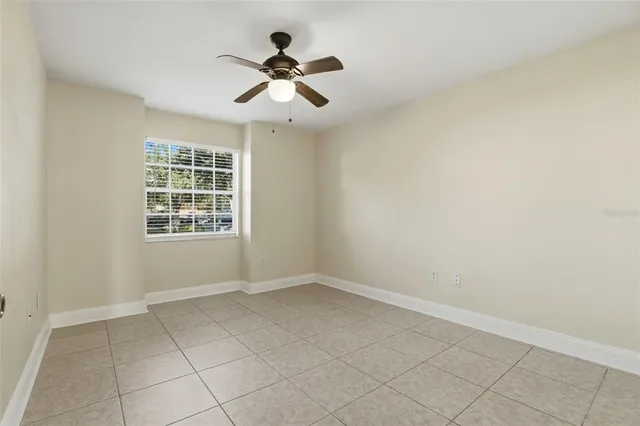 a bathroom with a granite countertop sink toilet a mirror a vanity and shower