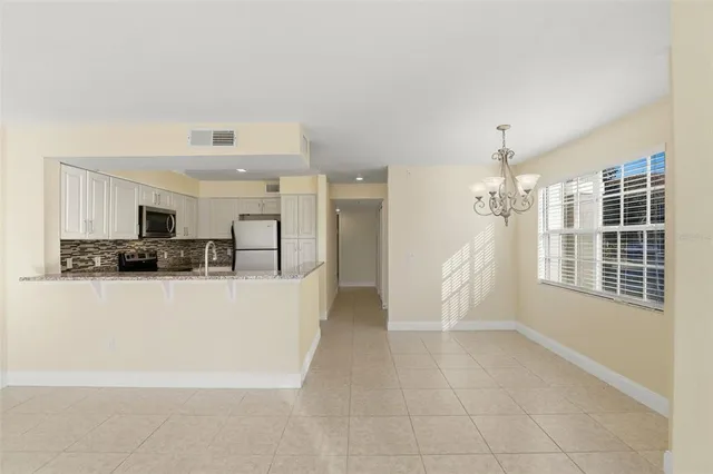 a view of a living room with furniture and a flat screen tv
