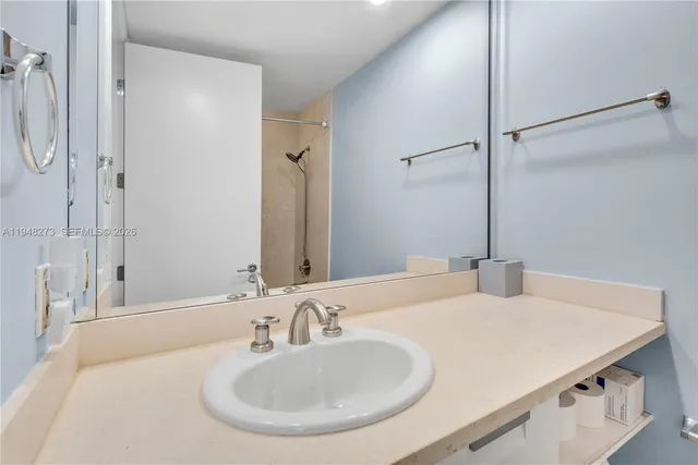 a bathroom with a sink and a mirror