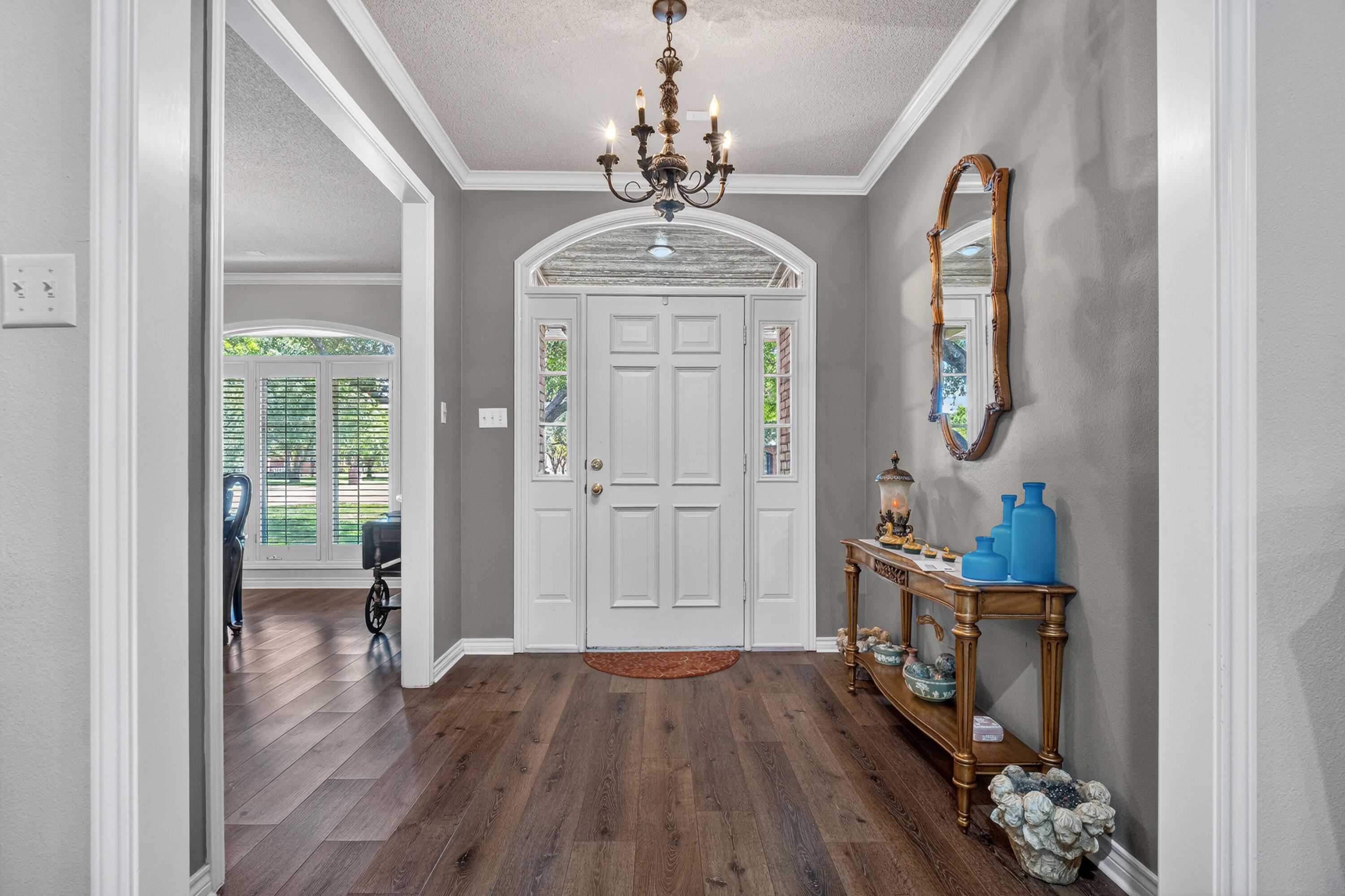 7402 95th Street Lubbock, TX 79424 - Photo 5 of 43 wooden floor in an empty room with a window