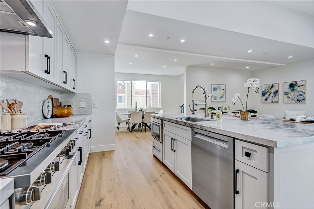 2405 Mathews Avenue, Unit B Redondo Beach, CA 90278 - Photo 12 of 46 a kitchen with stainless steel appliances a sink stove and cabinets