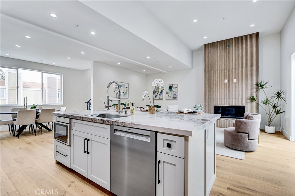 2405 Mathews Avenue, Unit B Redondo Beach, CA 90278 - Photo 15 of 46 a kitchen with counter space sink stove and chairs