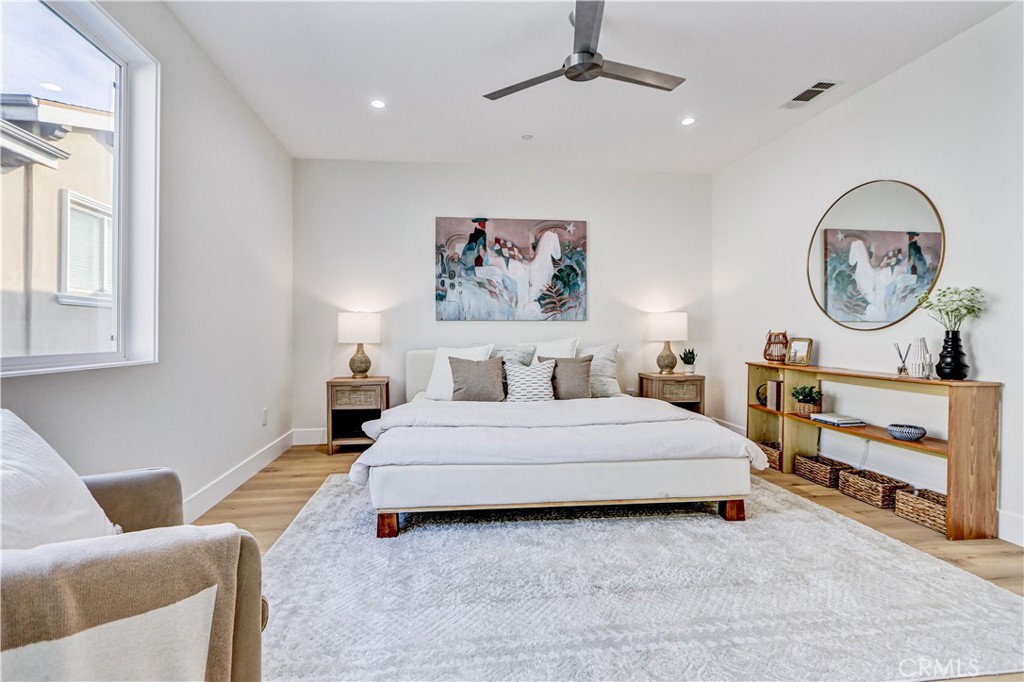 2405 Mathews Avenue, Unit B Redondo Beach, CA 90278 - Photo 26 of 46 a spacious bedroom with a bed and a chandelier