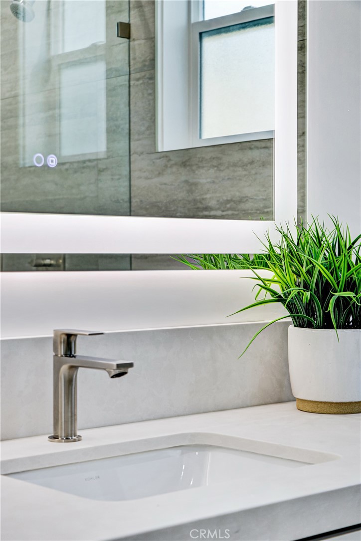 2405 Mathews Avenue, Unit B Redondo Beach, CA 90278 - Photo 29 of 46 a potted plant sitting on a window sill and a sink