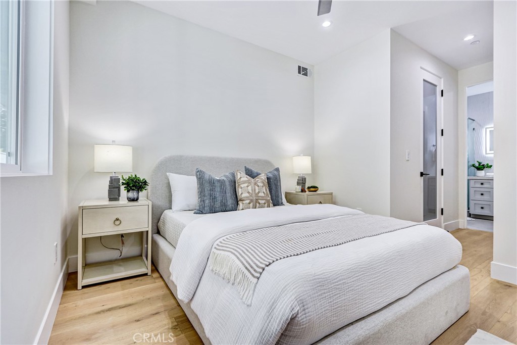 2405 Mathews Avenue, Unit B Redondo Beach, CA 90278 - Photo 34 of 46 a large bed sitting in a bedroom and a table