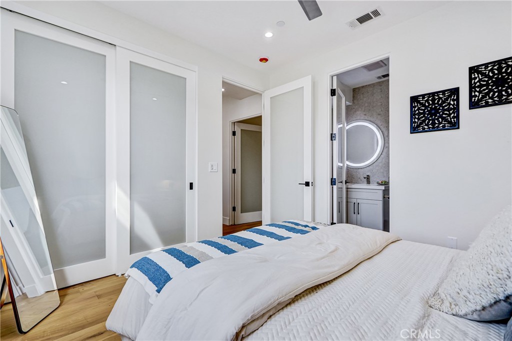 2405 Mathews Avenue, Unit B Redondo Beach, CA 90278 - Photo 38 of 46 a bedroom with a bed and wooden floor